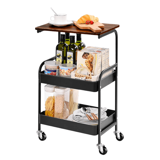 Este carrito organizador con mesa y 2 estantes es una solución práctica y versátil para optimizar cualquier espacio. Incorpora una superficie de MDF que funciona como mesa auxiliar, ideal para colocar una notebook, impresora u otros objetos de uso diario, adaptándose perfectamente a hogares, oficinas o dormitorios. Su diseño de dos niveles con bandeja superior elevada permite almacenar desde documentos y revistas hasta botellas o alimentos, brindando un excelente aprovechamiento del espacio. Fabricado con una estructura de acero resistente y superficie de MDF, garantiza durabilidad y estabilidad en el uso diario, con materiales resistentes a rayaduras y al óxido. Además, sus 4 ruedas giratorias facilitan el desplazamiento en cualquier dirección, mientras que las 2 ruedas con freno aseguran firmeza cuando lo necesitás. Compacto, funcional y fácil de integrar, es ideal para mantener todo organizado y al alcance.