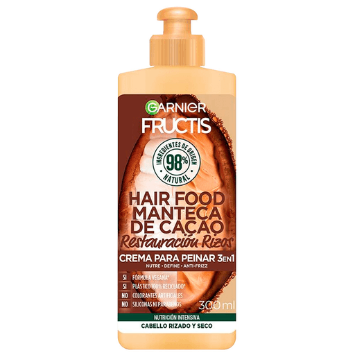 Crema para peinar 3en1 Fructis Hair Food enriquecida con Manteca de Cacao para cabello rizado y seco. Su fórmula nutre intensamente, define y brinda efecto antifrizz.