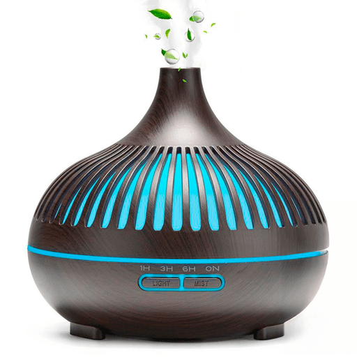 Este humidificador difusor es un producto innovador que brinda un ambiente agradable y saludable en tu hogar. Con un diseño de madera y fabricado con materiales de alta calidad, tiene una capacidad de 550ml para asegurar una difusión eficiente con ajustes de tiempo de atomización de 1, 3 y 6 horas. Además, cuenta con luz LED ajustable de 7 colores para crear una atmósfera relajante y personalizada.