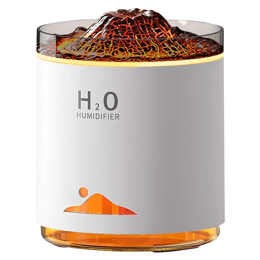 Este innovador Humidificador con un diseño único en forma de volcán, no solo transforma tu espacio con fragancias relajantes, sino que también crea un ambiente mágico gracias a su iluminación LED de varios colores. Los tonos suaves y cambiantes de la luz simulan el efecto de llamas, ofreciendo una experiencia visual y sensorial envolvente. Con una gran capacidad de 470ml, garantiza una difusión prolongada de fina niebla que hidrata y purifica el aire. Además, su tecnología de detección de nivel de agua previene el funcionamiento en seco, mientras que su operación ultrasilenciosa asegura tranquilidad, ideal para el descanso y la relajación.