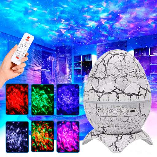 Este proyector en forma de huevo de dinosaurio transformará tus espacios en un universo de estrellas y nebulosas proyectadas en tus paredes y techo, creando un ambiente mágico y relajante. Con su diseño único y funcional, ofrece luces LED en colores vibrantes como violeta, blanco, rojo, verde y azul, que junto a su efecto nebuloso y láser simulan un cielo estrellado. Su manejo es sencillo gracias a los botones integrados para cambiar modos, ajustar iluminación y activar sonidos blancos, además de incluir un control remoto para mayor comodidad. Equipado con un parlante Bluetooth, base de apoyo y cable USB Tipo-C, este proyector combina estilo y tecnología para ambientar cualquier momento de forma moderna y eficaz.