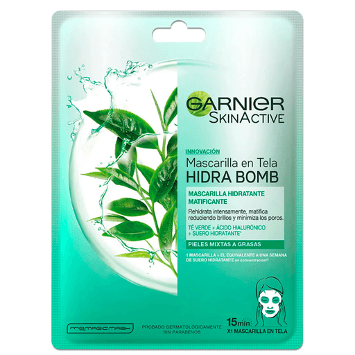 Mascarilla en tela hidratante matificante Hidra Bomb de Garnier con ácido hialurónico y extracto de té verde, rehidrata intensamente, matifica reduciendo brillos y minimiza los poros. Proporciona el equivalente a 1 semana de sérum hidratante en 15 minutos.
