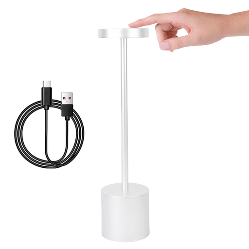 Esta Lámpara LED inalámbrica presenta un diseño innovador sin pantalla, proporciona una iluminación de 360º, uniforme y sin sombras ni parpadeos. Su base antideslizante, fabricada con material resistente al desgaste, garantiza estabilidad en cualquier superficie. Perfecta para diversas ocasiones, su luz cálida la convierte en la opción ideal para el dormitorio, mientras que su diseño versátil y fácil de ubicar la hace ideal como lámpara de escritorio o para crear un ambiente lujoso en restaurantes. Además, cuenta con 3 temperaturas de luz regulables, 4 niveles de brillo y una batería recargable de 3000mAh para mayor comodidad.